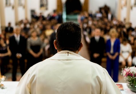 A Catholic priest addressing his congregation